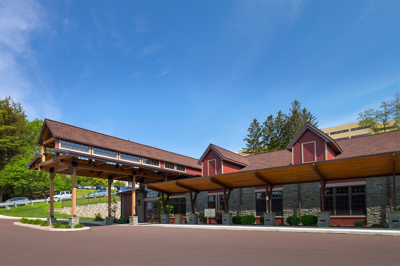 a building with a roof and a parking lot